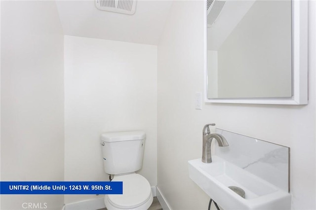 1241 W 95th St, Los Angeles, CA 90044 - half bathroom with toilet and a sink