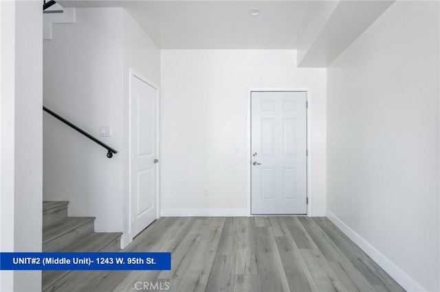 1241 W 95th St, Los Angeles, CA 90044 - staircase with wood finished floors and baseboards