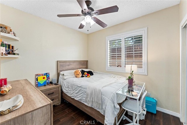 2901 Huston St, Pomona, CA 91767 - bedroom with dark wood-style flooring, a textured ceiling, and a ceiling fan