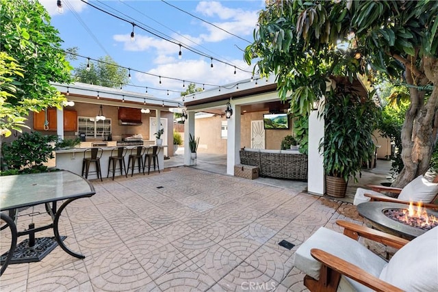 2901 Huston St, Pomona, CA 91767 - view of patio / terrace featuring an outdoor fire pit and an outdoor bar