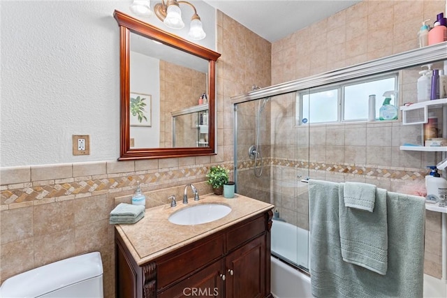 2901 Huston St, Pomona, CA 91767 - bathroom featuring tile walls, vanity, and enclosed tub / shower combo