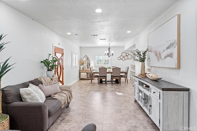2901 Huston St, Pomona, CA 91767 - living room with a chandelier, recessed lighting, and a textured ceiling