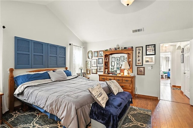 1115 Chennault Ave, Clovis, CA 93611 - bedroom with hardwood / wood-style floors and high vaulted ceiling