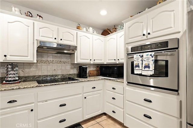 1115 Chennault Ave, Clovis, CA 93611 - kitchen featuring black appliances, under cabinet range hood, decorative backsplash, and white cabinetry
