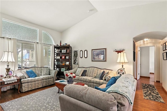 1115 Chennault Ave, Clovis, CA 93611 - living area with wood finished floors, high vaulted ceiling, and arched walkways