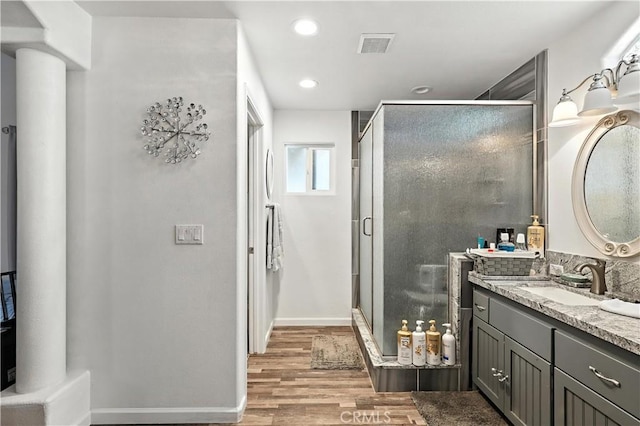 1115 Chennault Ave, Clovis, CA 93611 - full bath featuring vanity, wood finished floors, a shower stall, and recessed lighting