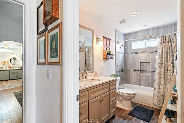 1115 Chennault Ave, Clovis, CA 93611 - bathroom with vanity, wood finished floors, and shower / bath combo with shower curtain