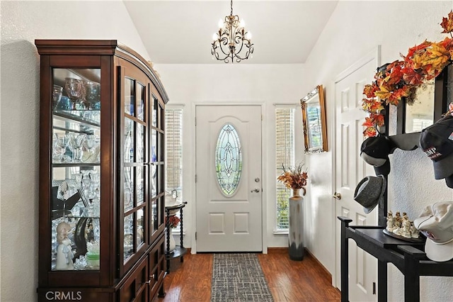 1115 Chennault Ave, Clovis, CA 93611 - entrance foyer featuring a chandelier, dark wood-style floors, healthy amount of natural light, and vaulted ceiling