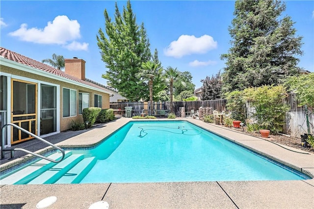 1115 Chennault Ave, Clovis, CA 93611 - view of swimming pool with a fenced backyard and a patio area
