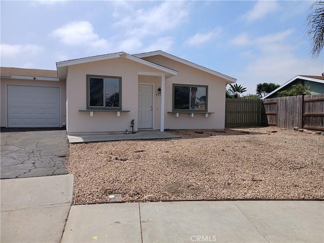4493 Estada, Oceanside, CA 92057 - view of front of property with driveway, a garage, and stucco siding