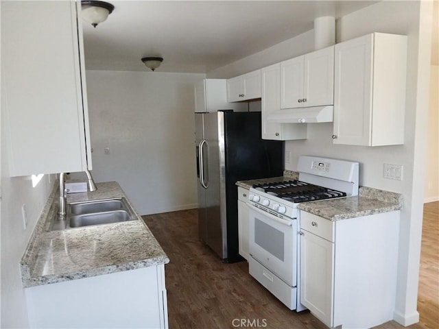 4493 Estada, Oceanside, CA 92057 - kitchen featuring white gas stove, under cabinet range hood, dark wood-style floors, and white cabinetry
