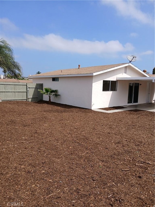 4493 Estada, Oceanside, CA 92057 - rear view of property featuring a gate, a patio, and stucco siding