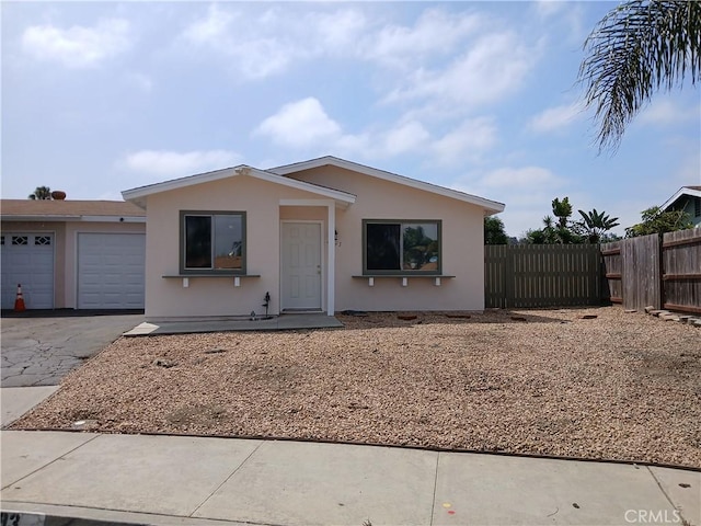4493 Estada, Oceanside, CA 92057 - view of front facade with stucco siding, driveway, and an attached garage