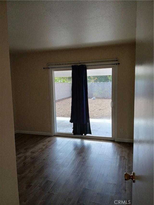 4493 Estada, Oceanside, CA 92057 - unfurnished room with baseboards and wood finished floors