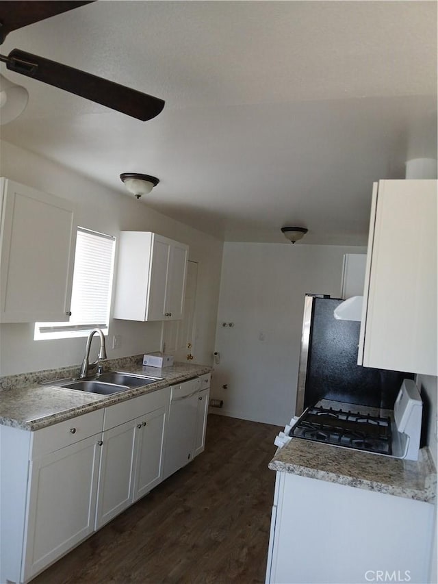 4493 Estada, Oceanside, CA 92057 - kitchen with range, dark wood-style flooring, dishwasher, and white cabinetry