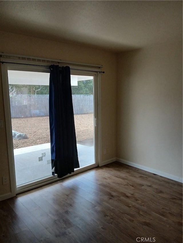 4493 Estada, Oceanside, CA 92057 - unfurnished room featuring wood finished floors and baseboards