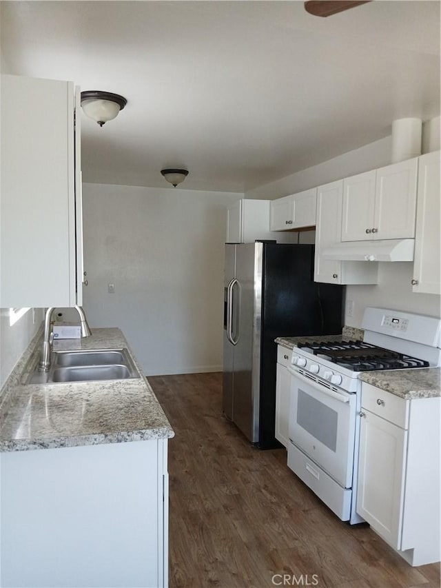 4493 Estada, Oceanside, CA 92057 - kitchen featuring gas range gas stove, under cabinet range hood, dark wood-style floors, and white cabinetry