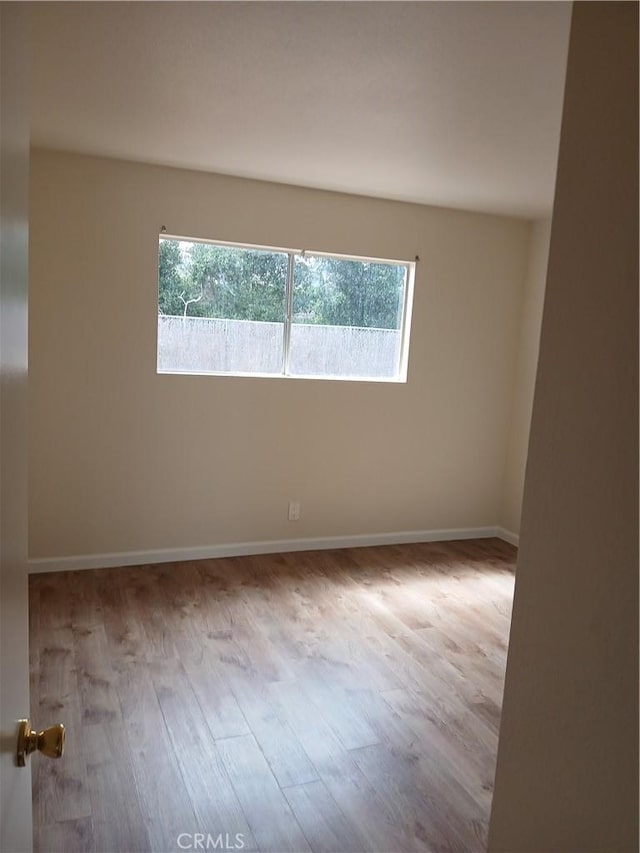 4493 Estada, Oceanside, CA 92057 - unfurnished room with healthy amount of natural light and wood finished floors