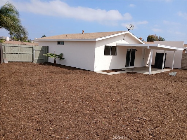 4493 Estada, Oceanside, CA 92057 - back of property featuring a patio, a gate, and stucco siding