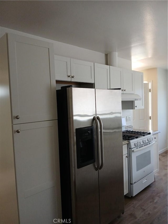4493 Estada, Oceanside, CA 92057 - kitchen with stainless steel fridge, white range with gas cooktop, under cabinet range hood, white cabinetry, and dark wood-style floors