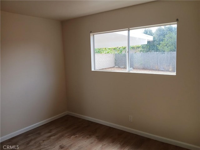 4493 Estada, Oceanside, CA 92057 - spare room featuring plenty of natural light and wood finished floors