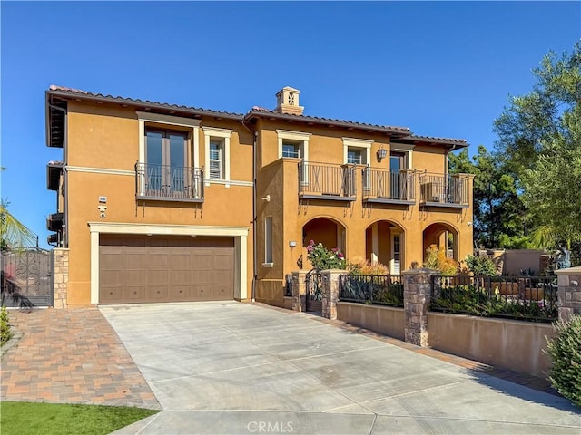 1278 Inspiration, West Covina, CA 91791 - mediterranean / spanish home with a balcony, stucco siding, concrete driveway, a tiled roof, and an attached garage