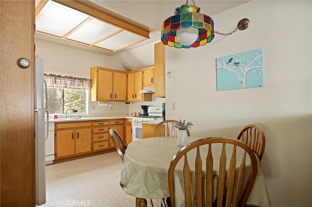 1230 Bear Springs Rd, Rimforest, CA 92378 - kitchen featuring white appliances, under cabinet range hood, light countertops, lofted ceiling, and a skylight