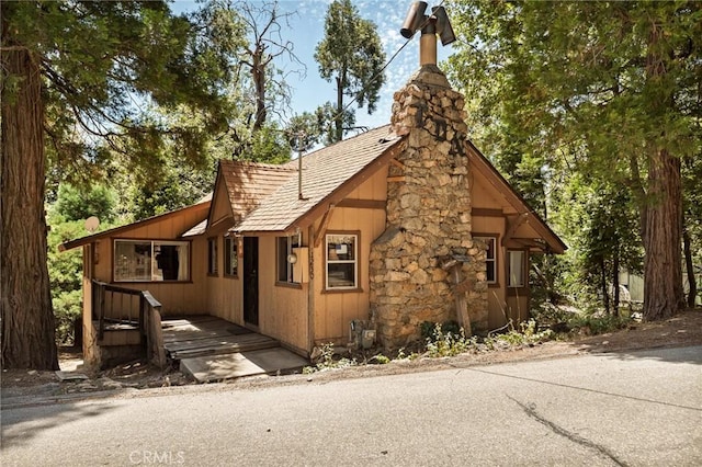 1230 Bear Springs Rd, Rimforest, CA 92378 - view of property exterior with a chimney and a shingled roof