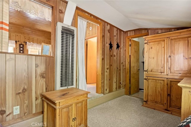 1230 Bear Springs Rd, Rimforest, CA 92378 - hallway with vaulted ceiling, carpet floors, wood walls, and a heating unit