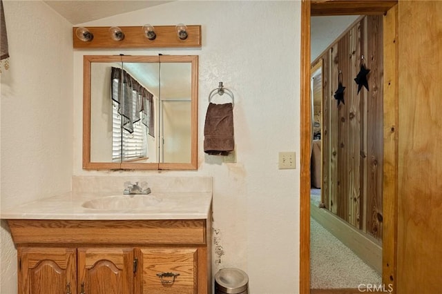 1230 Bear Springs Rd, Rimforest, CA 92378 - bathroom featuring vanity, lofted ceiling, and a textured wall