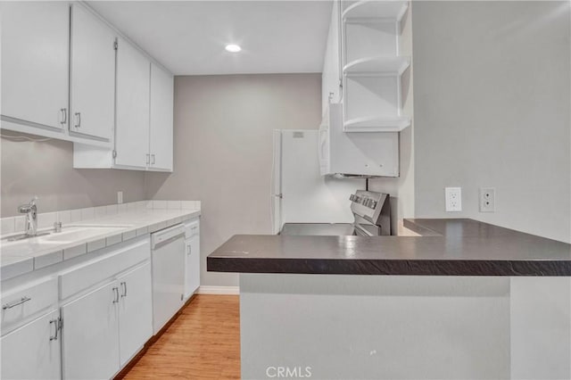 3603 W Hidden Ln Unit 210, Rolling Hills Estates, CA 90274 - kitchen with open shelves, white appliances, white cabinets, a peninsula, and light wood-style floors