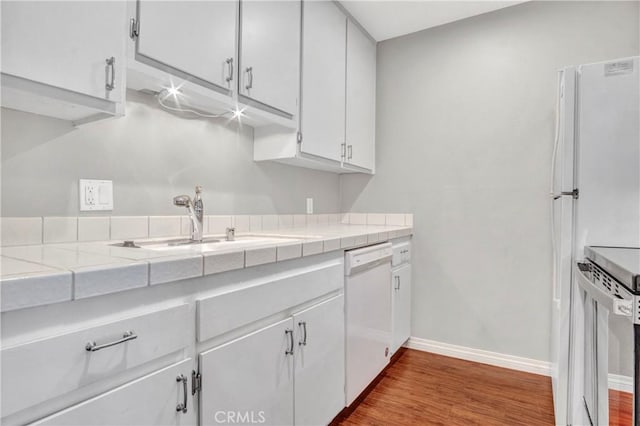 3603 W Hidden Ln Unit 210, Rolling Hills Estates, CA 90274 - kitchen with white dishwasher, white cabinetry, range, dark wood-style floors, and tile counters