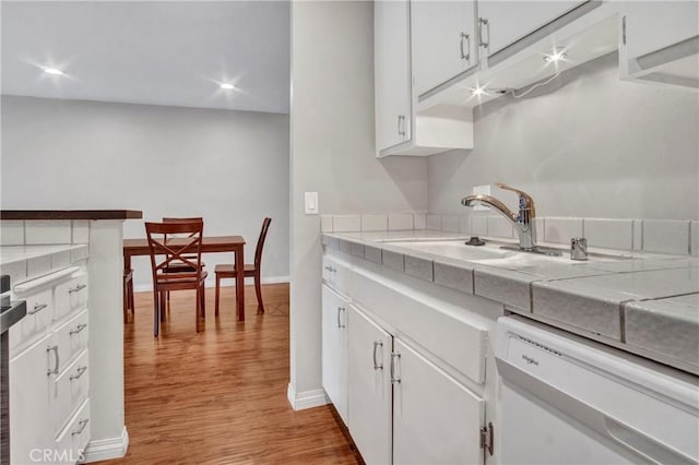 3603 W Hidden Ln Unit 210, Rolling Hills Estates, CA 90274 - kitchen with dishwashing machine, light wood-style floors, white cabinets, tile countertops, and recessed lighting