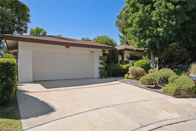 4241 Kingfisher Rd, Calabasas, CA 91302 - view of front of property featuring stucco siding and concrete driveway