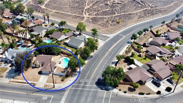 7707 Bolton Ave, Riverside, CA 92503 - aerial view of property and surrounding area with nearby suburban area