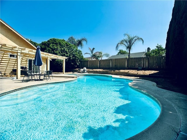 7707 Bolton Ave, Riverside, CA 92503 - view of swimming pool with a pergola, a patio area, and a fenced backyard