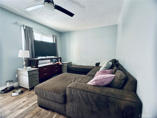 7707 Bolton Ave, Riverside, CA 92503 - living room with a textured ceiling, wood finished floors, and ceiling fan