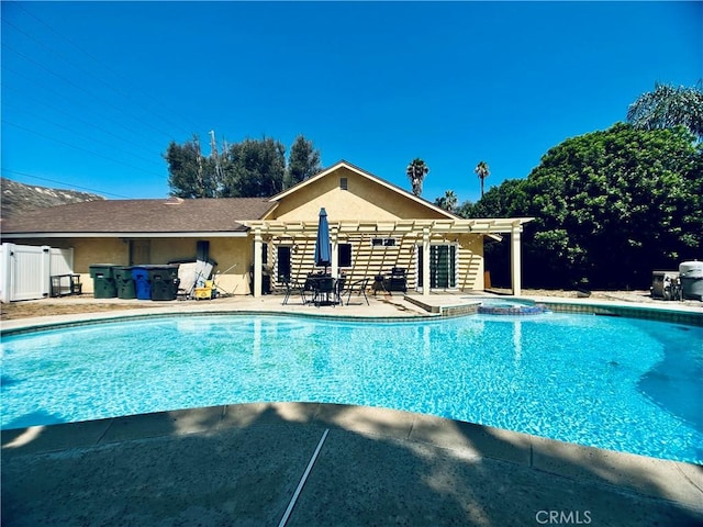 7707 Bolton Ave, Riverside, CA 92503 - view of pool with a pergola, a pool with connected hot tub, and a patio area