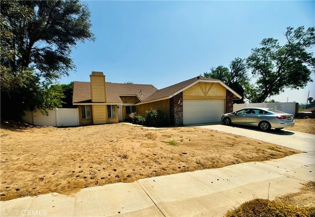7707 Bolton Ave, Riverside, CA 92503 - view of front of house featuring concrete driveway, a chimney, an attached garage, and brick siding