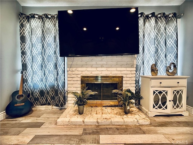7707 Bolton Ave, Riverside, CA 92503 - living area with wood finished floors and a fireplace