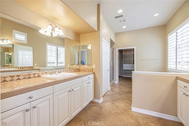 23785 Western Cedar Ct, Valencia, CA 91354 - full bathroom featuring vanity, plenty of natural light, and tile patterned flooring