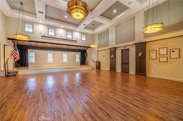 23785 Western Cedar Ct, Valencia, CA 91354 - unfurnished living room with a towering ceiling, coffered ceiling, wood finished floors, and beam ceiling
