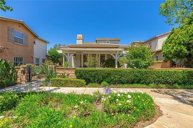 23785 Western Cedar Ct, Valencia, CA 91354 - view of front of house with a chimney