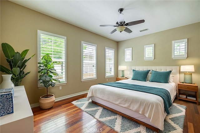 23785 Western Cedar Ct, Valencia, CA 91354 - bedroom featuring wood-type flooring, multiple windows, and a ceiling fan