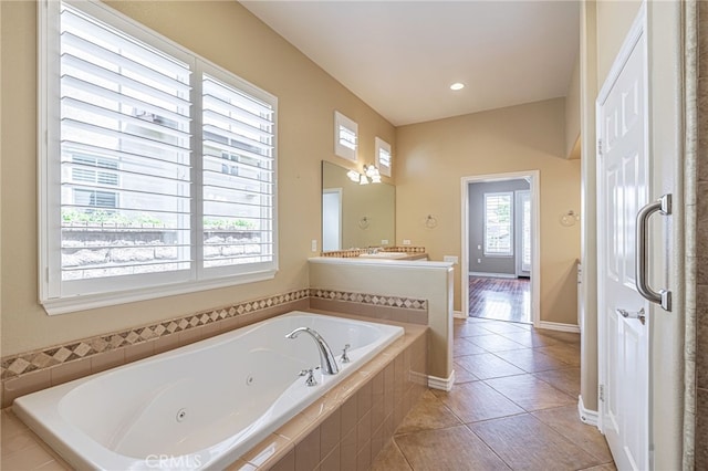 23785 Western Cedar Ct, Valencia, CA 91354 - bathroom featuring a tub with jets, tile patterned flooring, and vanity