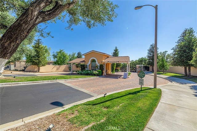 23785 Western Cedar Ct, Valencia, CA 91354 - mediterranean / spanish home with a tile roof and stucco siding