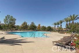 23785 Western Cedar Ct, Valencia, CA 91354 - community pool featuring a patio area