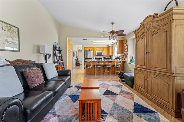 31941 Via Tafalla, Temecula, CA 92592 - living area featuring vaulted ceiling, light tile patterned floors, and a ceiling fan