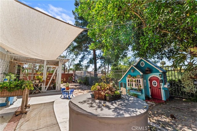 31941 Via Tafalla, Temecula, CA 92592 - fenced backyard with a patio area and an outbuilding