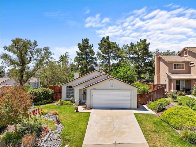 31941 Via Tafalla, Temecula, CA 92592 - view of front facade featuring concrete driveway, a chimney, a garage, stucco siding, and a tile roof
